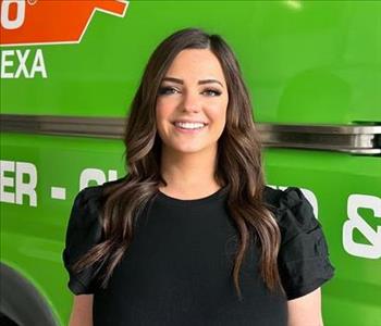 Woman standing in front of SERVPRO Fleet 