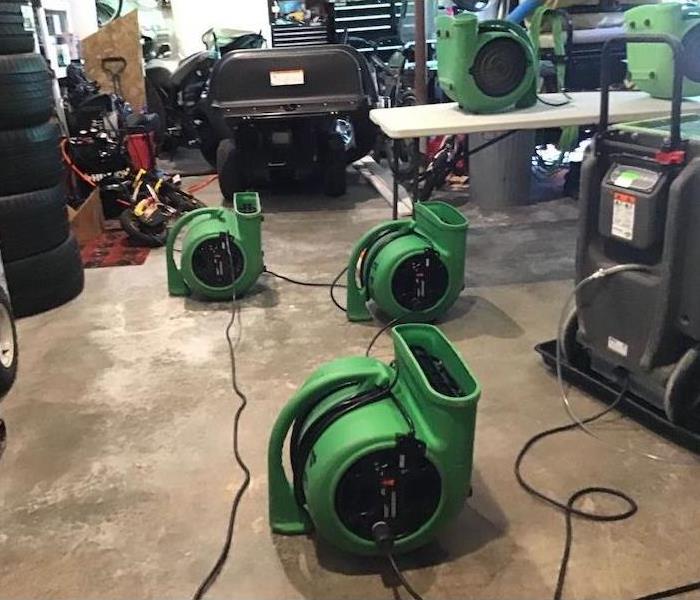 Garage with multiple SERVPRO air movers 